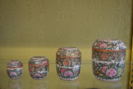 A graduated set of four Canton porcelain jars and covers.