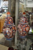 A pair of Imari jars and covers.