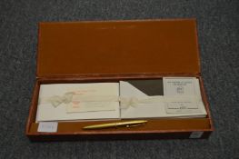 A cased writing set.