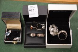 A group of rings and earrings.