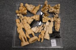 A collection of carved ivory netsukes and okimonos.