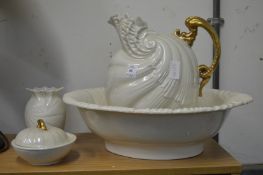 A shell shaped jug and bowl set with matching vase and soap dish.