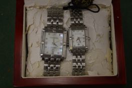 A His and Hers stainless steel wristwatch.