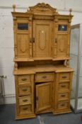 A large 19th century continental pine two-part cupboard.