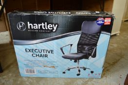 An office swivel armchair, boxed.