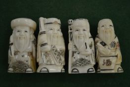 A set of four ivory netsukes.