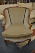 A good French style carved beech framed armchair.