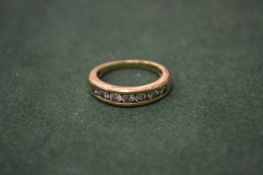 An 18ct gold and seven stone diamond ring.