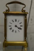 A brass carriage clock.