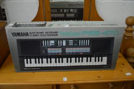 A boxed Yamaha keyboard.