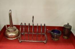 A silver toast rack and other items.
