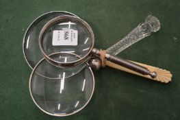 Three magnifying glasses.