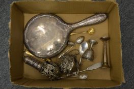 A group of small silverware.