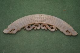 A Chinese carved jade amulet.