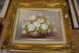 Two still lifes of flowers in a vase, oil on canvas in decorative gilt frames, together with another