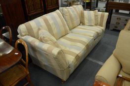 A good Duresta large two-seater settee upholstered in a beige striped material.