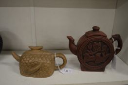 Two Chinese Yixing pottery teapots.
