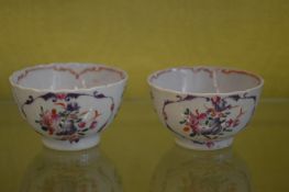 A pair of Famille Rose tea bowls.
