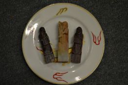 Three Chinese carved soapstone seals and a Japanese plate.