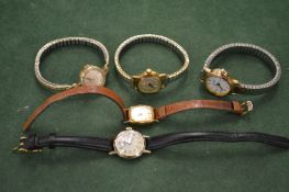 Four various ladies' wristwatches.