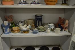 A shelf of decorative china.