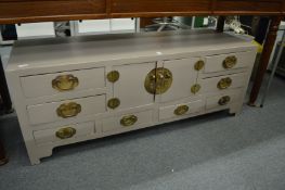 A painted Chinese low cupboard / chest unit.