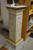 A classical style painted wood pedestal.