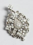 A SUPERB WHITE GOLD DIAMOND CLUSTER PENDANT.