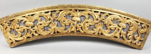 A GOOD GILTWOOD CARVED ARCH, HINGED. 9ft 6ins long, 10ins deep.