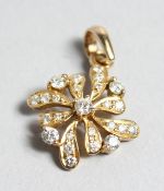 AN18CT GOLD AND DIAMOND CLUSTER PENDANT.