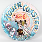 A ROUND PAINTED FAIRGROUND SIGN roller coaster - The Big Drop. 26ins diameter.