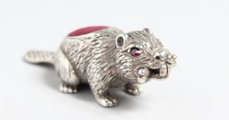 A CAST SILVER BEAVER PIN CUSHION.