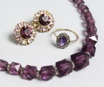 A SUITE OF JEWELLERY: NECKLACE, RING AND EARRINGS.