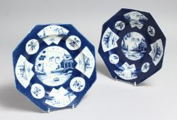 A PAIR OF WORCESTER POWDER BLUE OCTAGONAL PLATES with Chinese vignettes. 7.5ins diameter, Zorensky