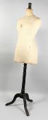 A VICTORIAN SHOP MANNEQUIN on a tripod base