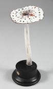 A MUSHROOM SPECIMEN, 6.5ins high, on a circular base.