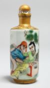 A CHINESE PORCELAIN EROTIC SNUFF BOTTLE. 3.5ins long