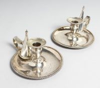 A PAIR OF GEORGE III CIRCULAR CHAMBER CANDLESTICKS AND SNUFFERS. 5ins diameter. London 1814. Maker