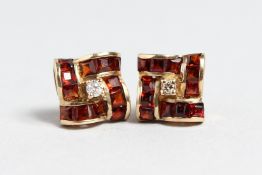 A PAIR OF 9CT GOLD GARNET EARRINGS.