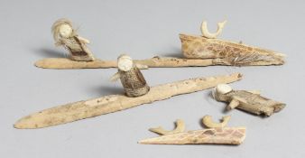 AN ESKIMO WHALE BONE CARVING.