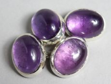 A PAIR OF SILVER CUFF LINKS.