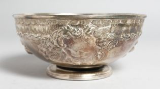 A GEORGE III CIRCULAR BOWL with chased and repousse decoration. 6.5ins diameter. London 1800.