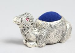 A SILVER PLATED CAMEL PIN CUSHION.