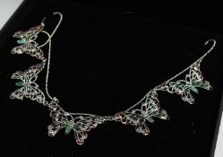 A SILVER, EMERALD AND PLIQUE ENAMEL BUTTERFLY NECKLACE.