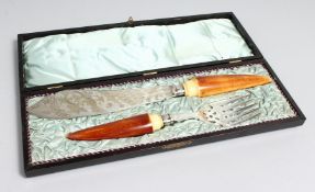 A VERY GOOD PAIR OF ENGRAVED FISH SERVERS with horn handles in a Japanese box with inscription,
