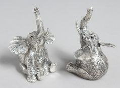 A PAIR OF .800 WHITE METAL ELEPHANT SALTS AND PEPPERS