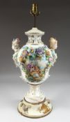 A GOOD MEISSEN STYLE PORCELAIN LAMP encrusted with flowers, painted panels and finial head
