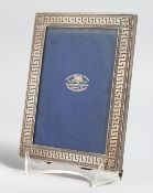 A GOLDSMITHS AND SILVERSMITHS SILVER PHOTOGRAPH FRAME with key pattern border. 6.5ins x 4.5ins.
