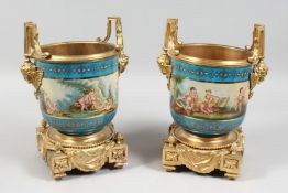 A GOOD PAIR OF SEVERS DESIGN PORCELAIN AND GILT METAL CACHE POTS painted with cymbals. 7.5ins
