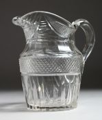 A GOOD VICTORIAN CUT GLASS JUG. 7.25ins high.
